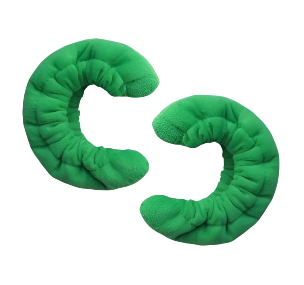 Pair of green terry cloth blade soakers for figure skates, displayed on a clean white background.