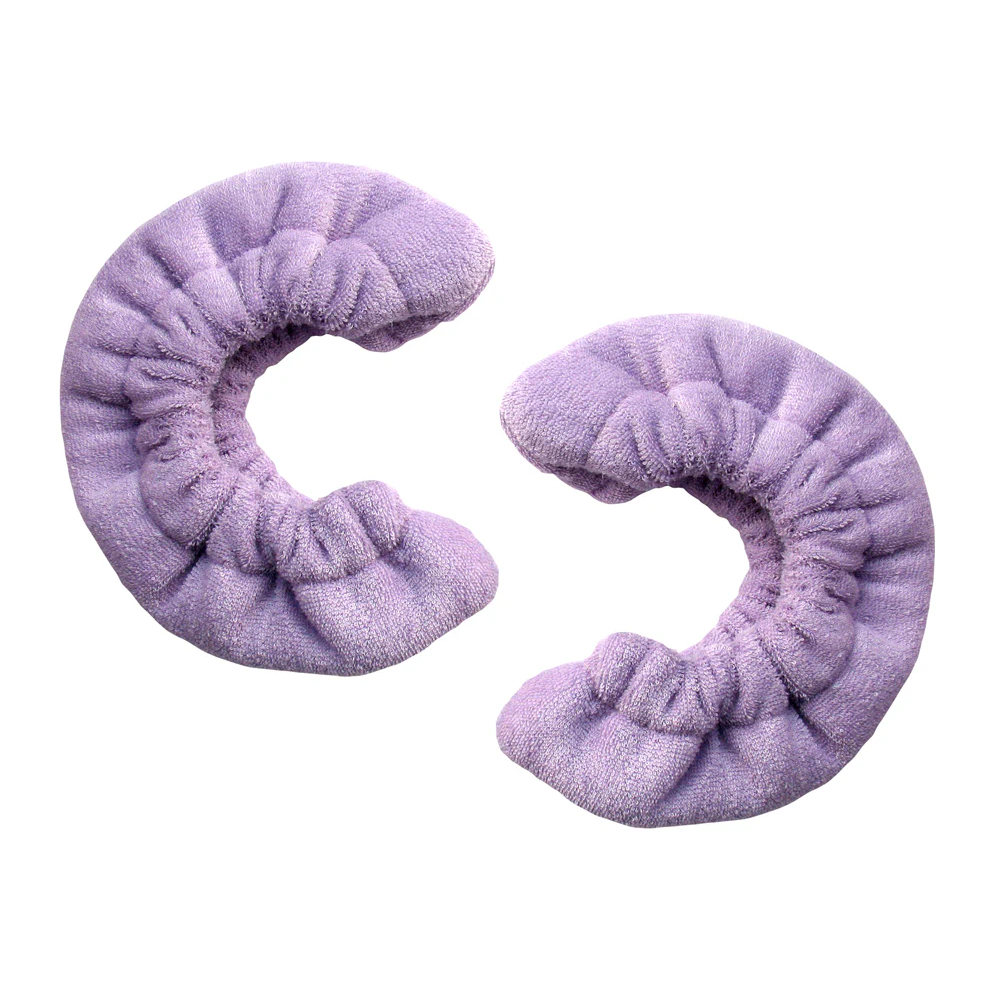 Pair of purple terry cloth blade soakers for figure skates, displayed on a white background