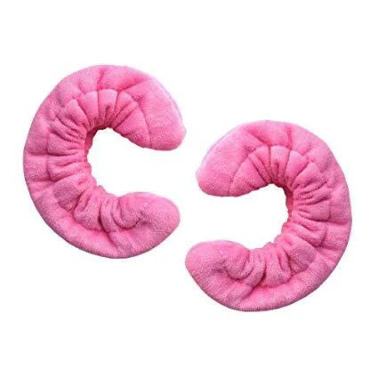 Pair of pink terry cloth blade soakers for figure skates, displayed on a white background.