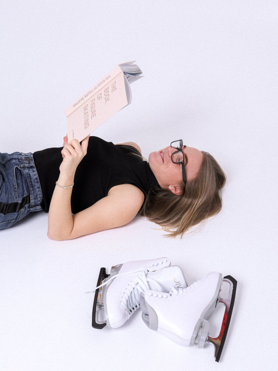 girl+laying+down+with+figure+skating+book